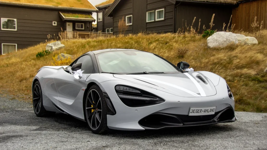 Gray sports coupe parked during daytime